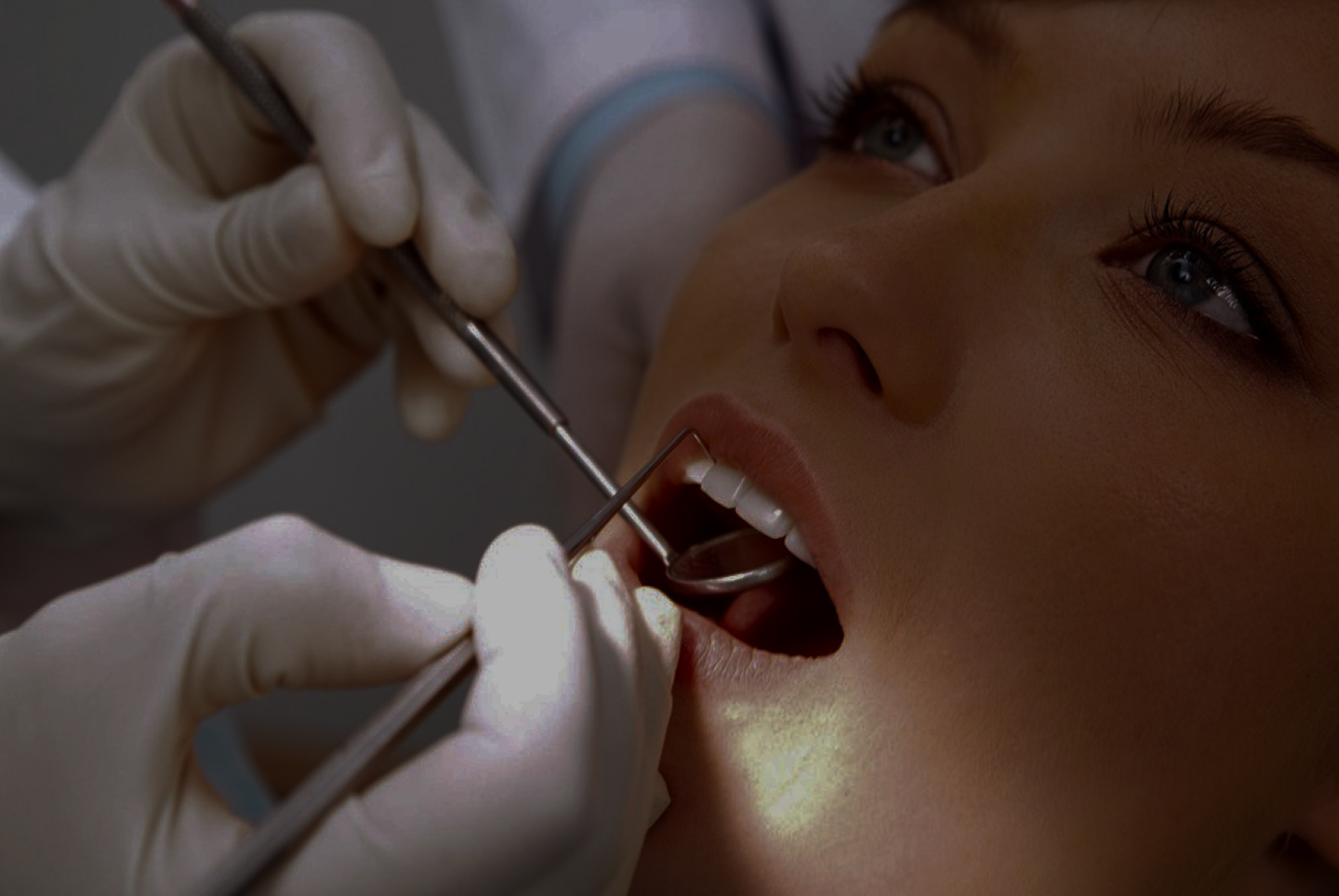 A dentist working on a patient.